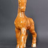 Ceramic horse sculpture with wild glaze and gold, signed Art Deco.