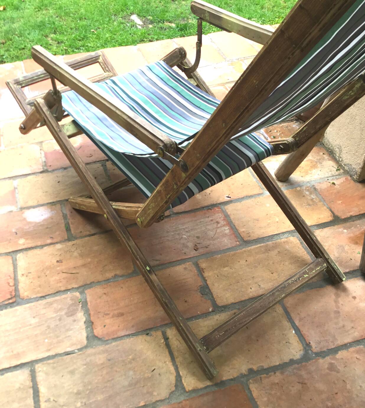 Pair of 19th-century wooden deck chairs with pegged frames and wrought iron