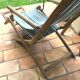 Pair of 19th-century wooden deck chairs with pegged frames and wrought iron