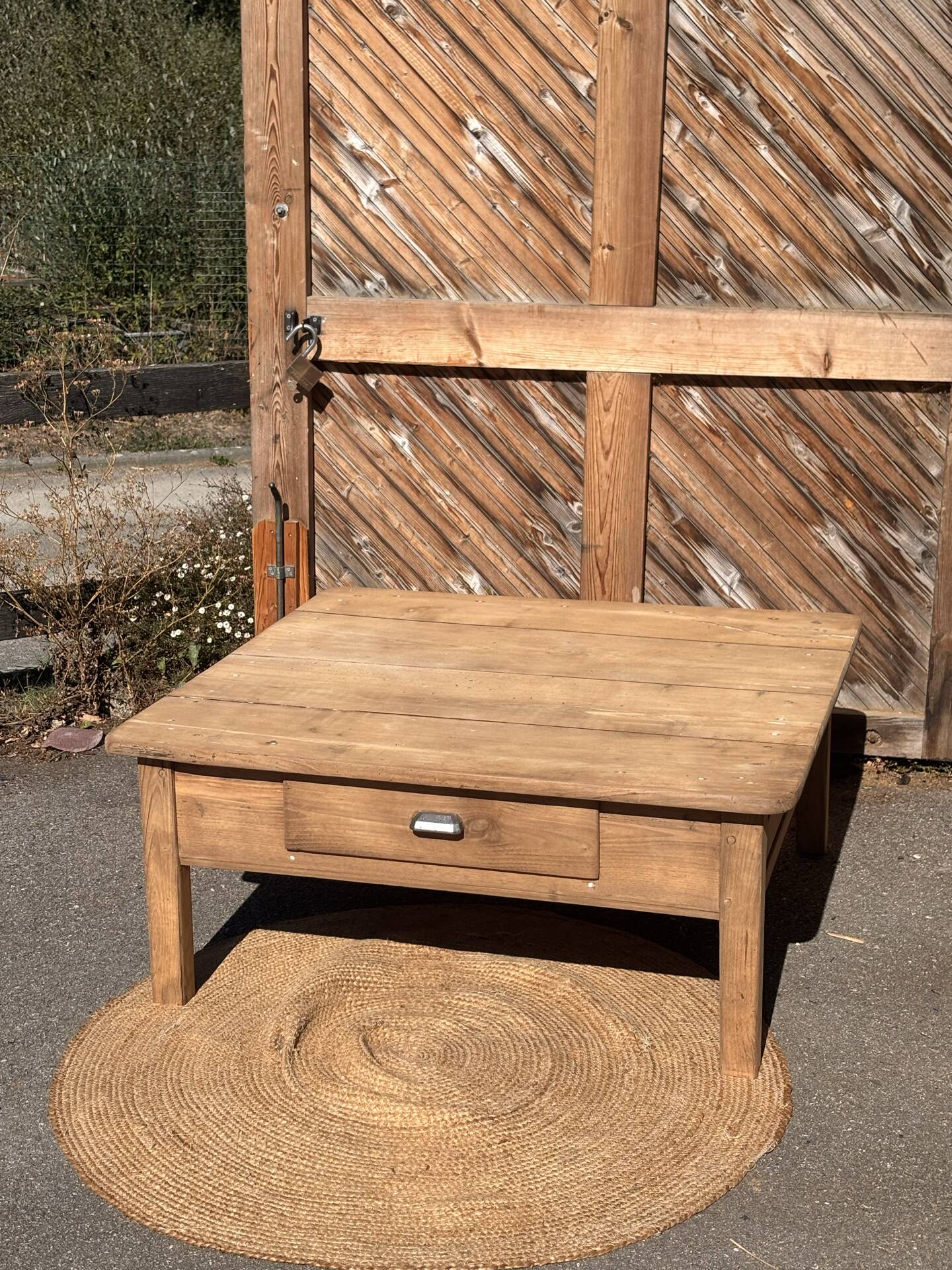 Large square farmhouse coffee table made of raw solid oak.