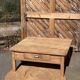 Large square farmhouse coffee table made of raw solid oak.