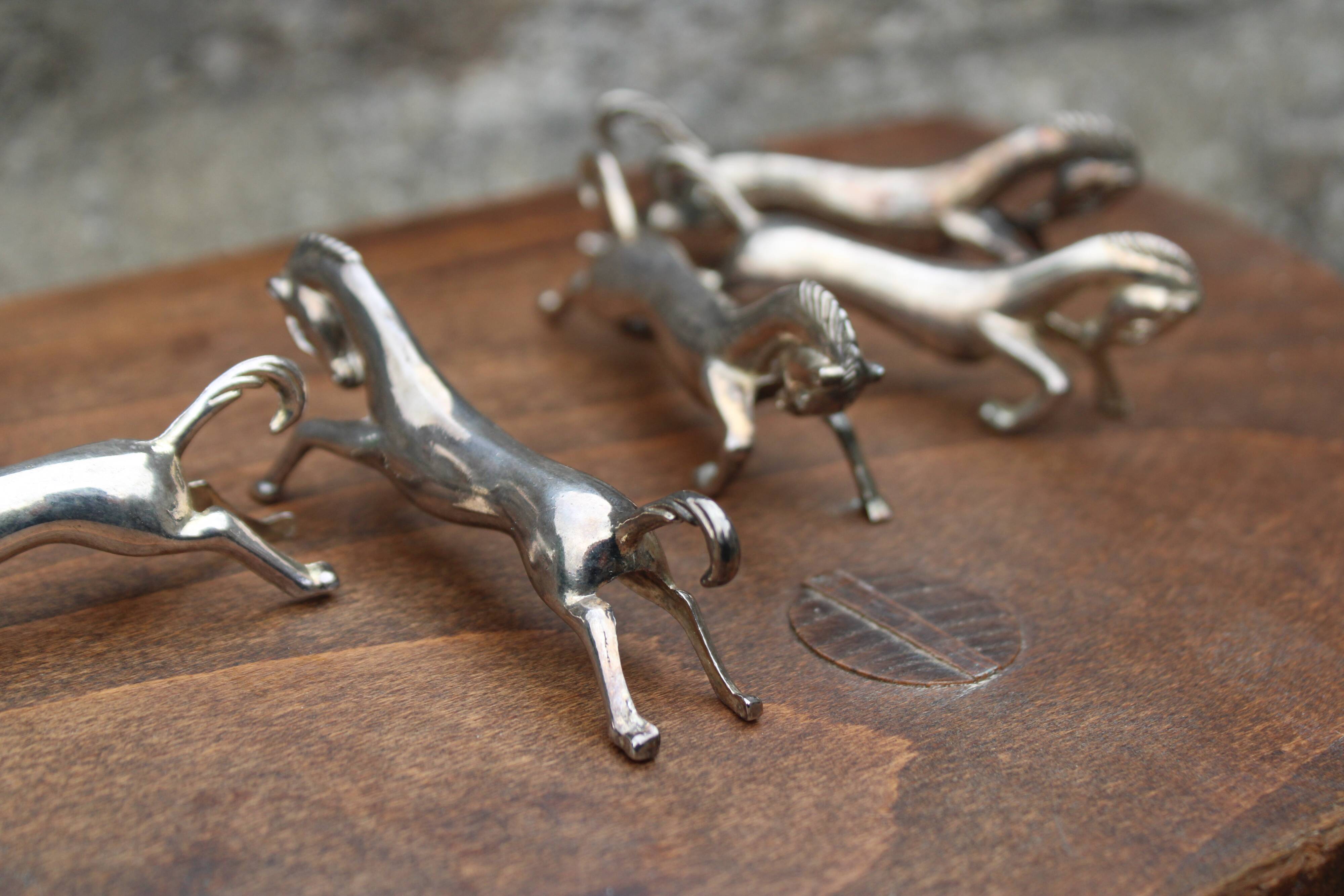 Set of 5 vintage silver metal horse knife rests