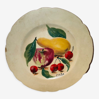 Faience plate in Longwy enamels signed Léa Valenti representing Fruits