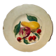 Faience plate in Longwy enamels signed Léa Valenti representing Fruits