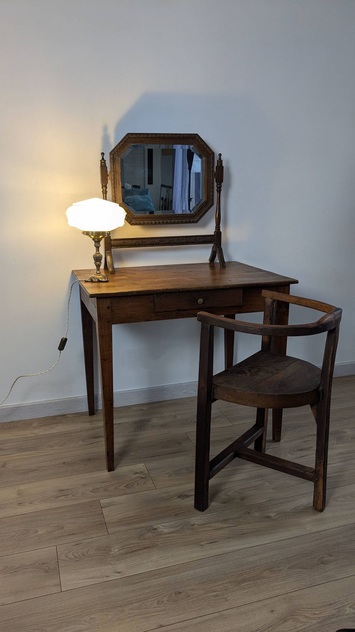 Antique beveled octagonal vanity mirror in carved wood