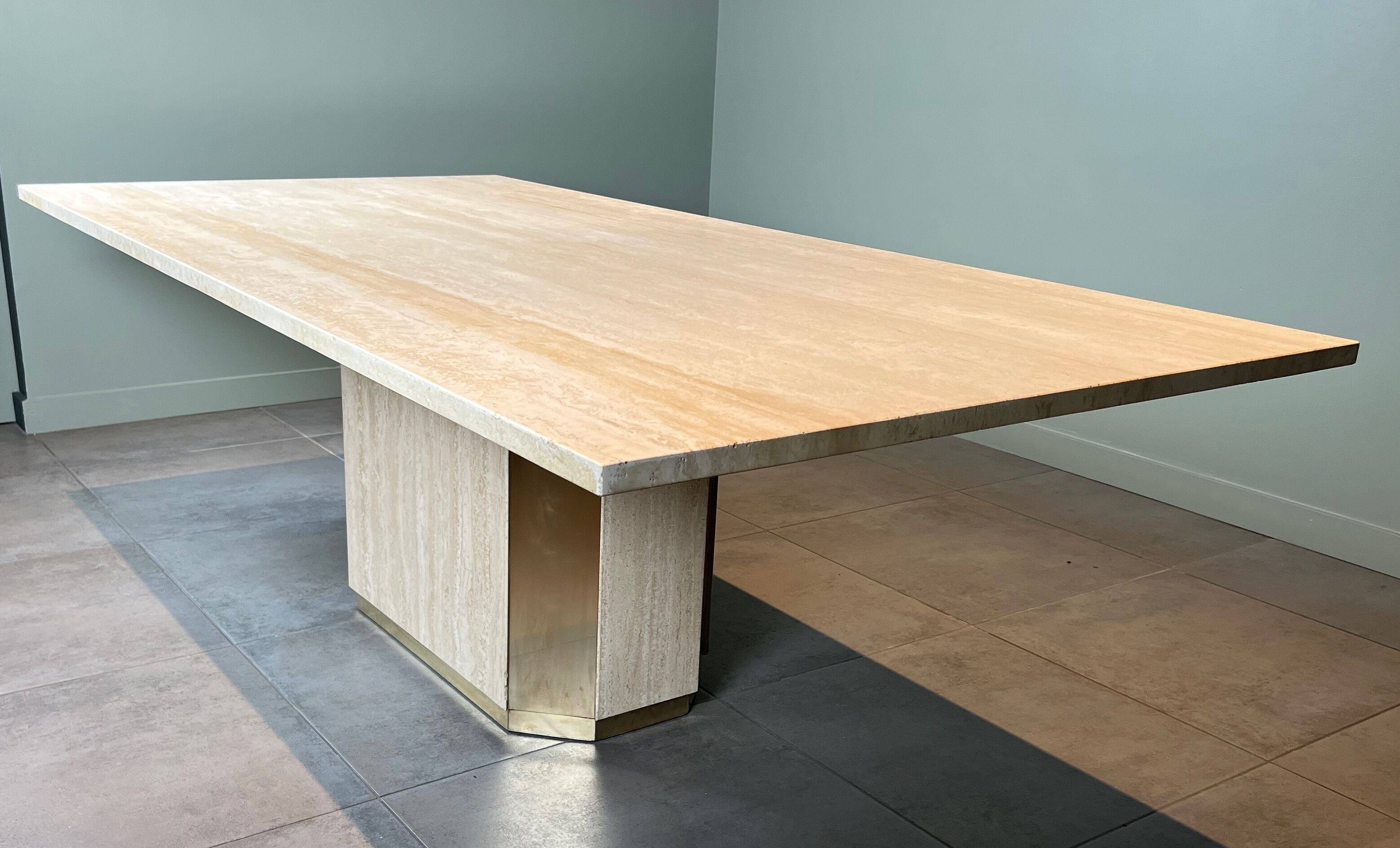 Dining table in travertine and brass. French work. Around 1970.
