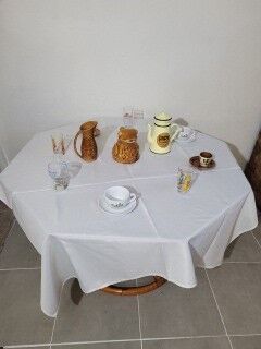 Rattan table and smoked glass