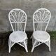 Pair of white peacock rattan chairs, circa 1960