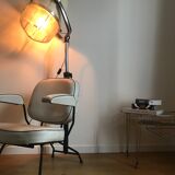 Vintage hairdresser's armchair with helmet transformed into a lamp