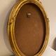 Golden oval wooden frame