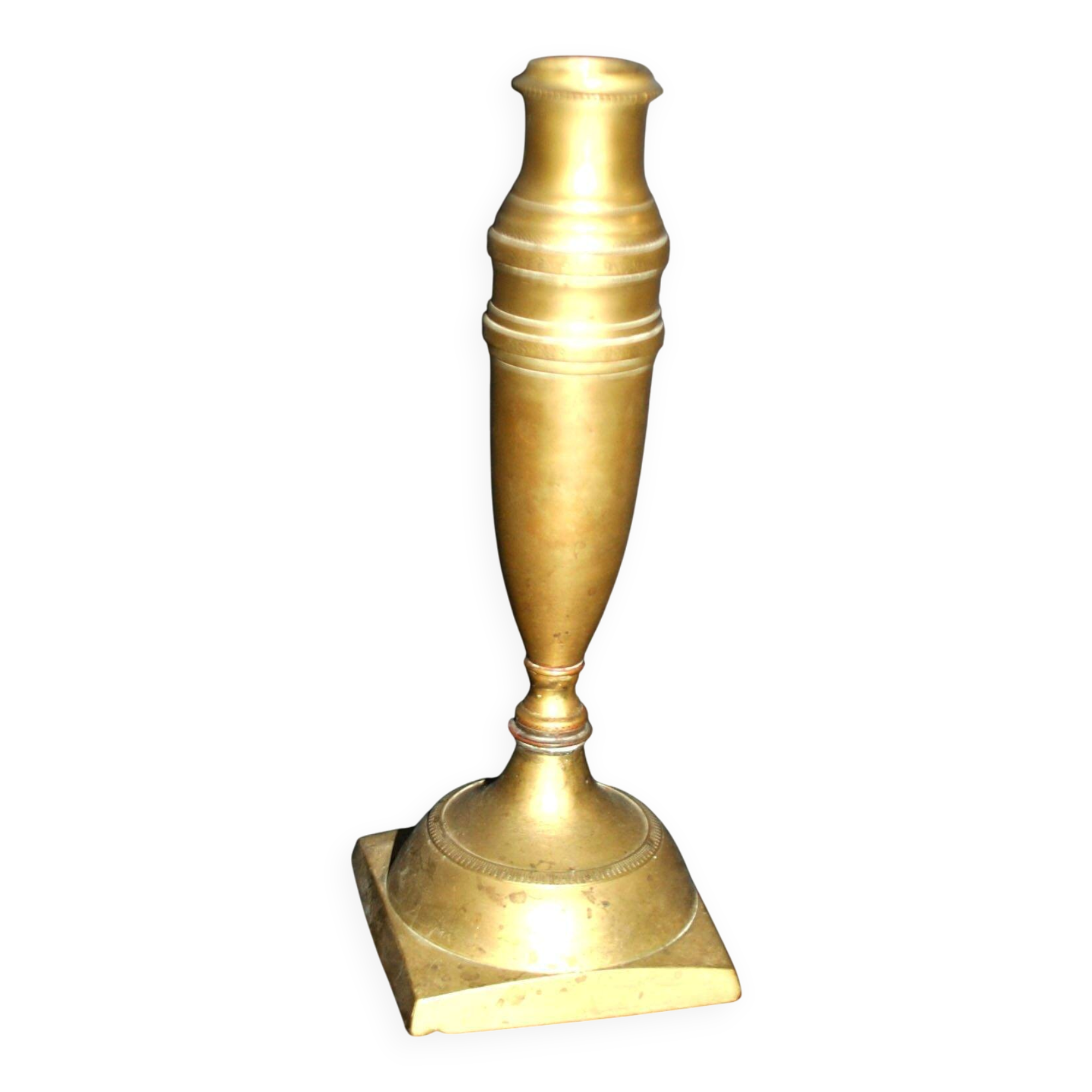Antique baluster candlestick in bronze with hand-chiseled design.