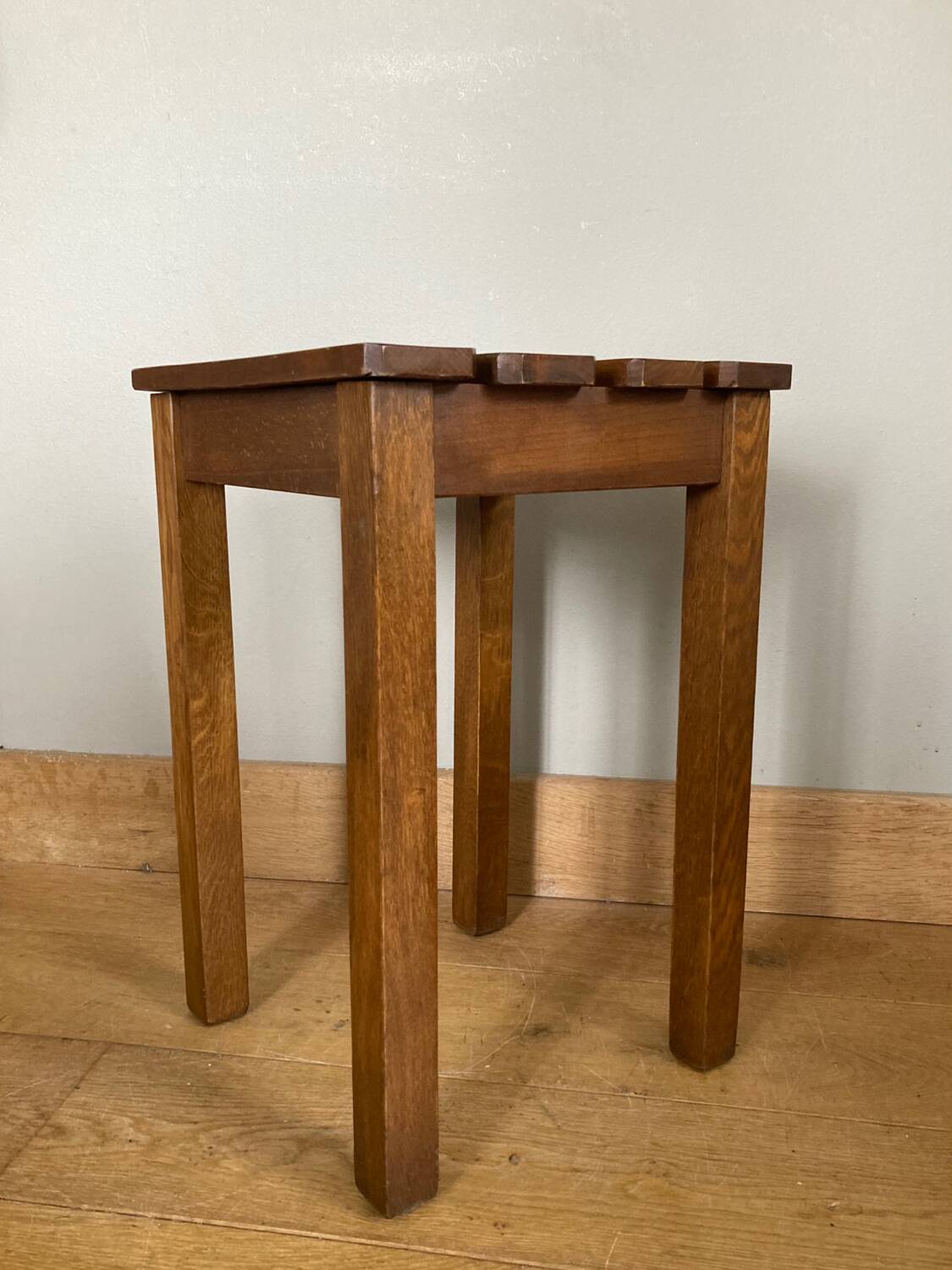 Wooden stool with central grip, quadripod base, 20th century