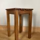 Wooden stool with central grip, quadripod base, 20th century
