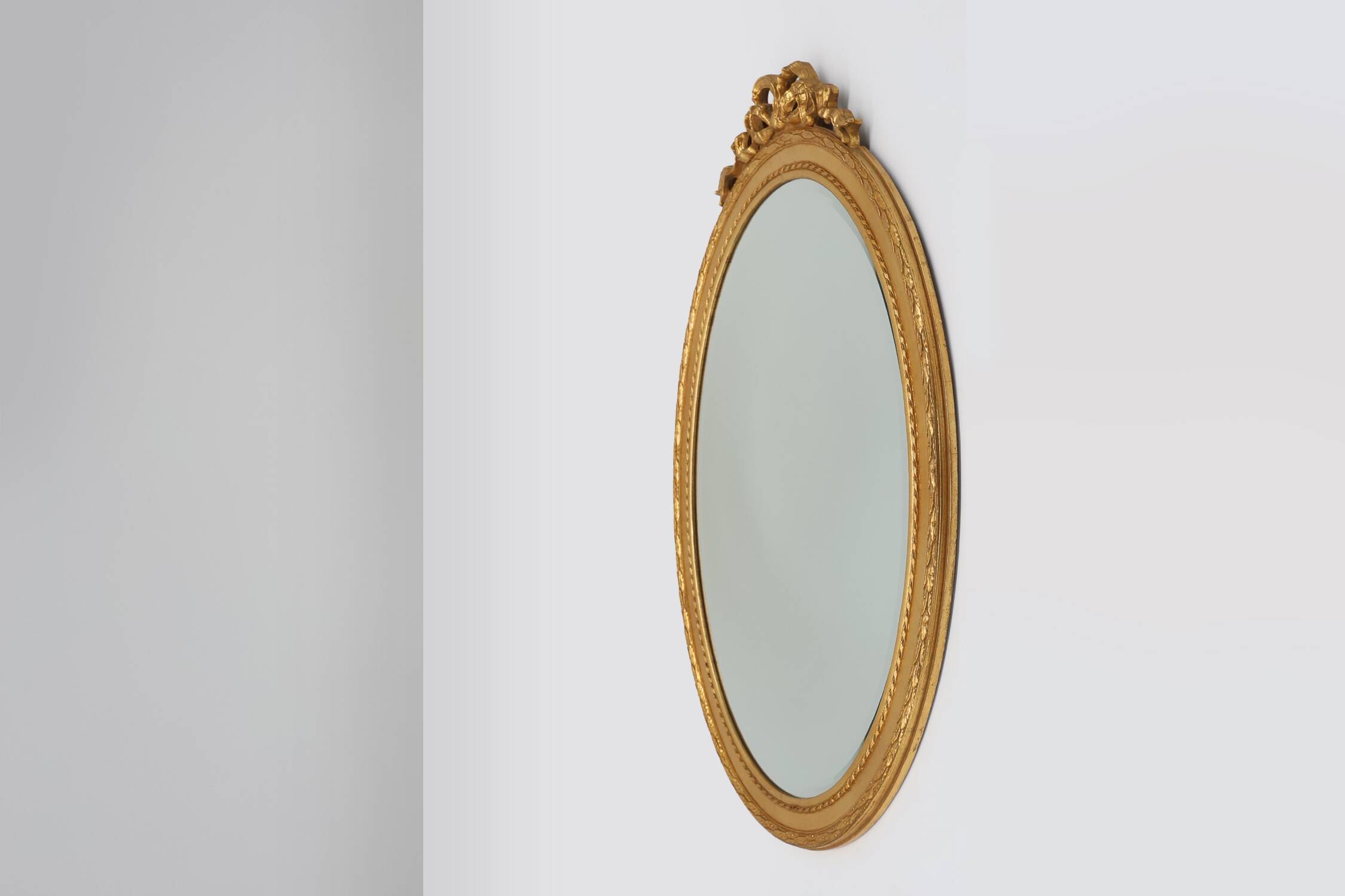 Oval shaped carved gilded Baroque mirror with beveled glass, Belgium