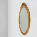 Oval shaped carved gilded Baroque mirror with beveled glass, Belgium