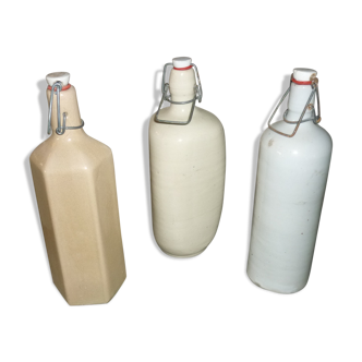 3 old bottles proceeded in the stoneware