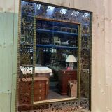 Venetian mirror in eglomise glass and gilded wood
