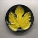 Wall plate by Pol Chambost with leaf pattern.