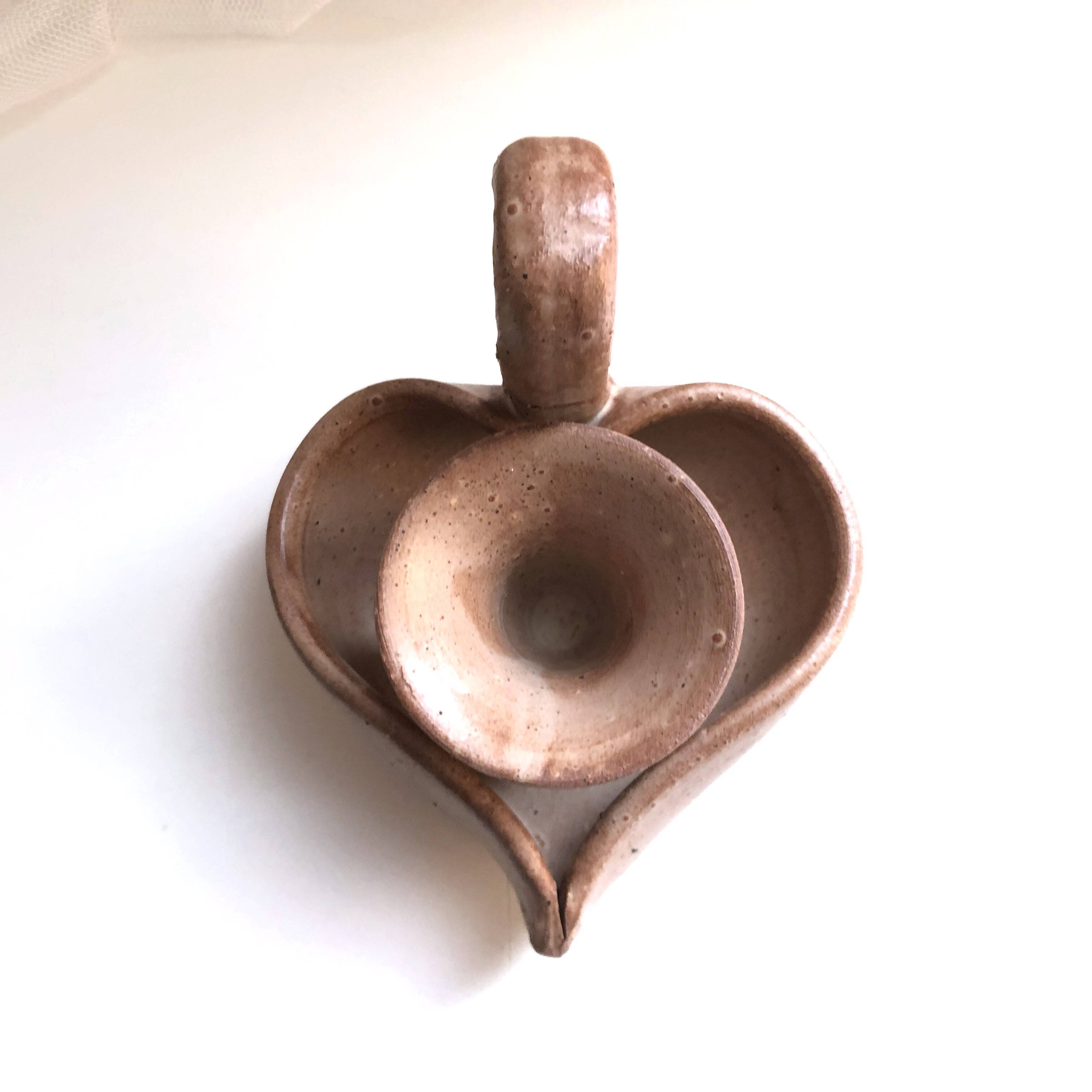Glazed stoneware heart-shaped hand candle holder
