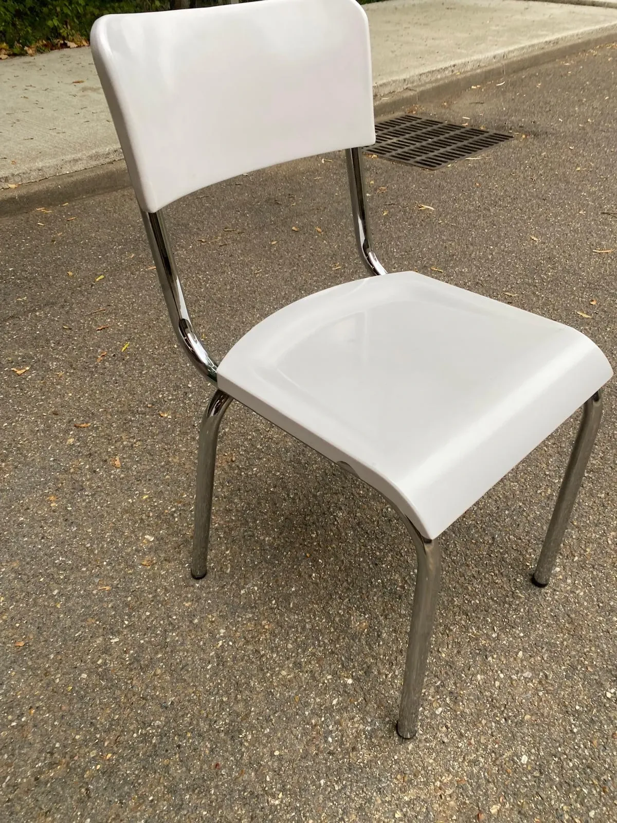 Space age chair with chrome metal and white schoolboy shell, desk 1970.