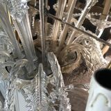 Venetian mirror topped with half a chandelier of Murano