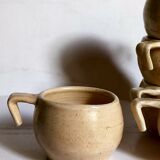 Six vintage potter's ceramic cups with vanilla enamel