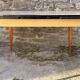 Beige French modernist extendable table, wooden legs, circa 1955.