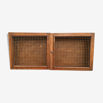 Vintage wall cabinet screened in wood
