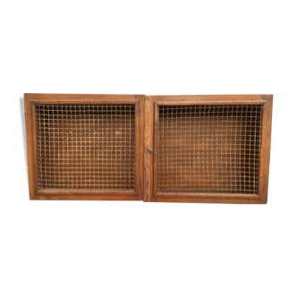 Vintage wall cabinet screened in wood