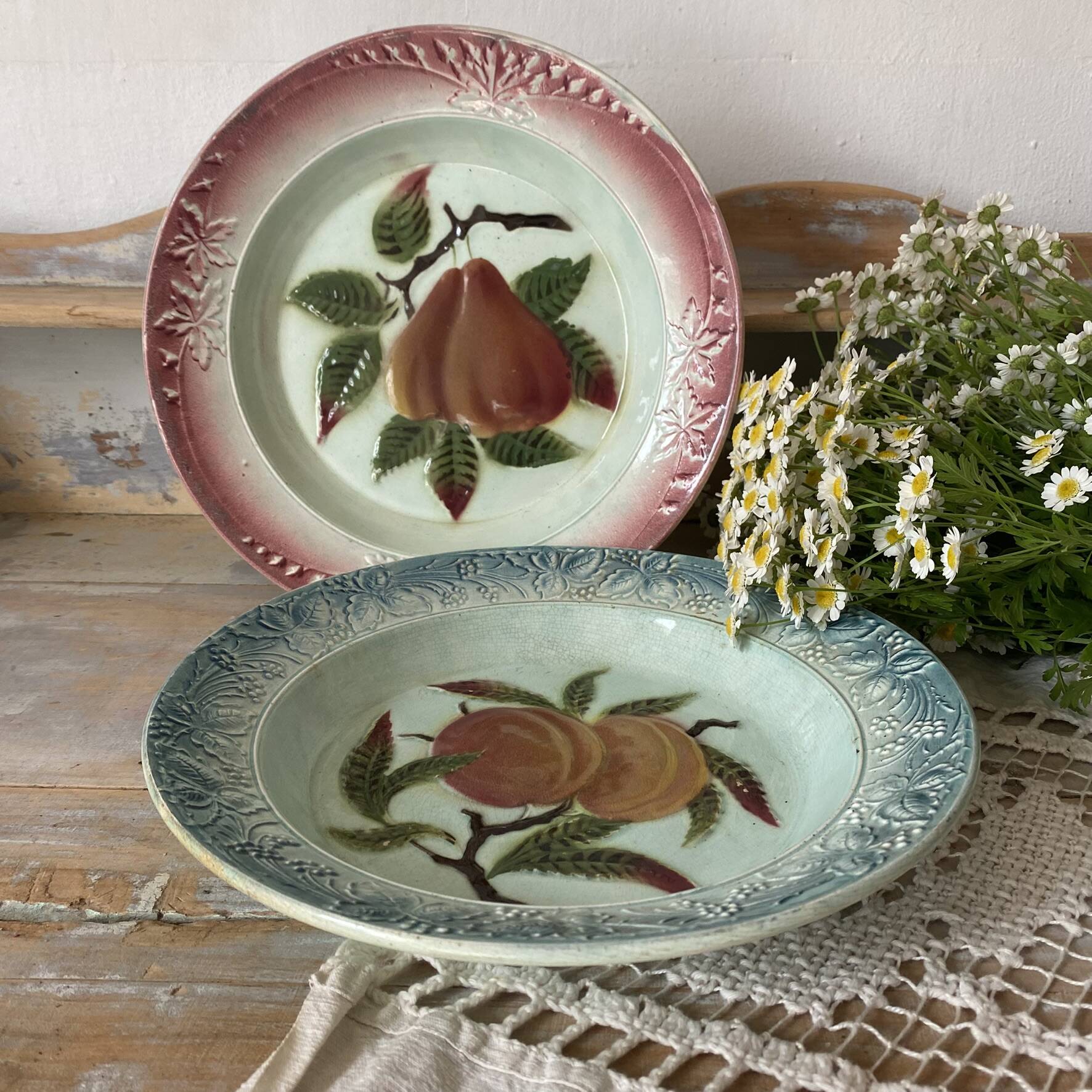 Shallow dish in slip with fruit decoration of peaches.
