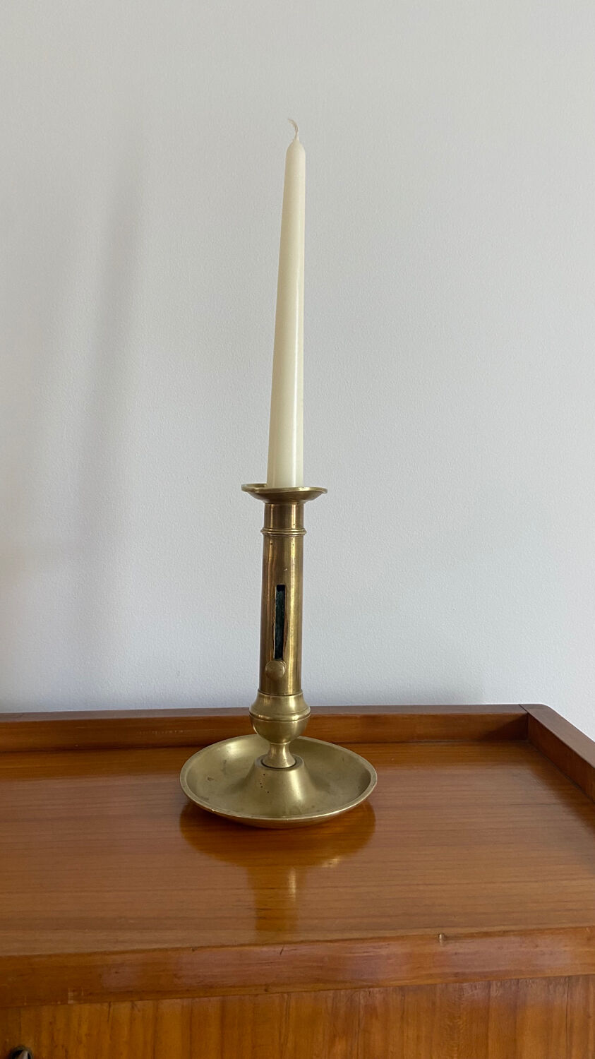 Antique brass push candle holder