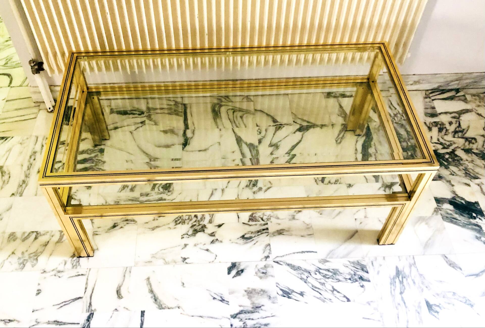 Coffee table with 2 brass and glass tops signed Pierre Vandel Paris, circa 70s.