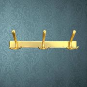 Vintage wall-mounted coat rack in anodised gold aluminium with 3 hooks from the 1970s.