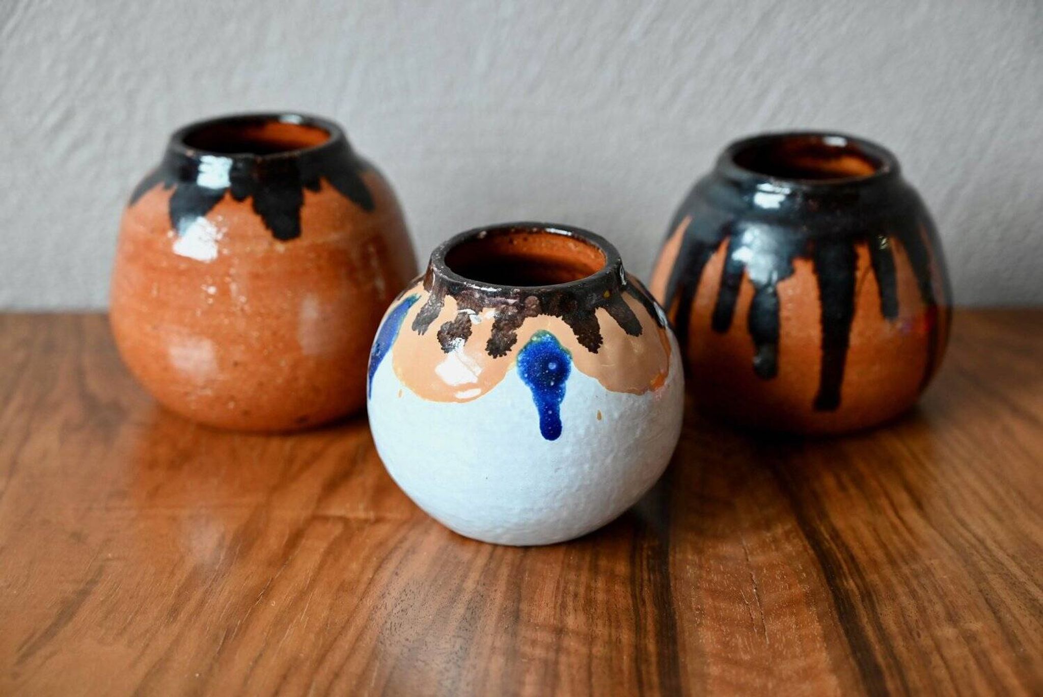 Set of three ethnic glazed terracotta ball vases from the 1970s.