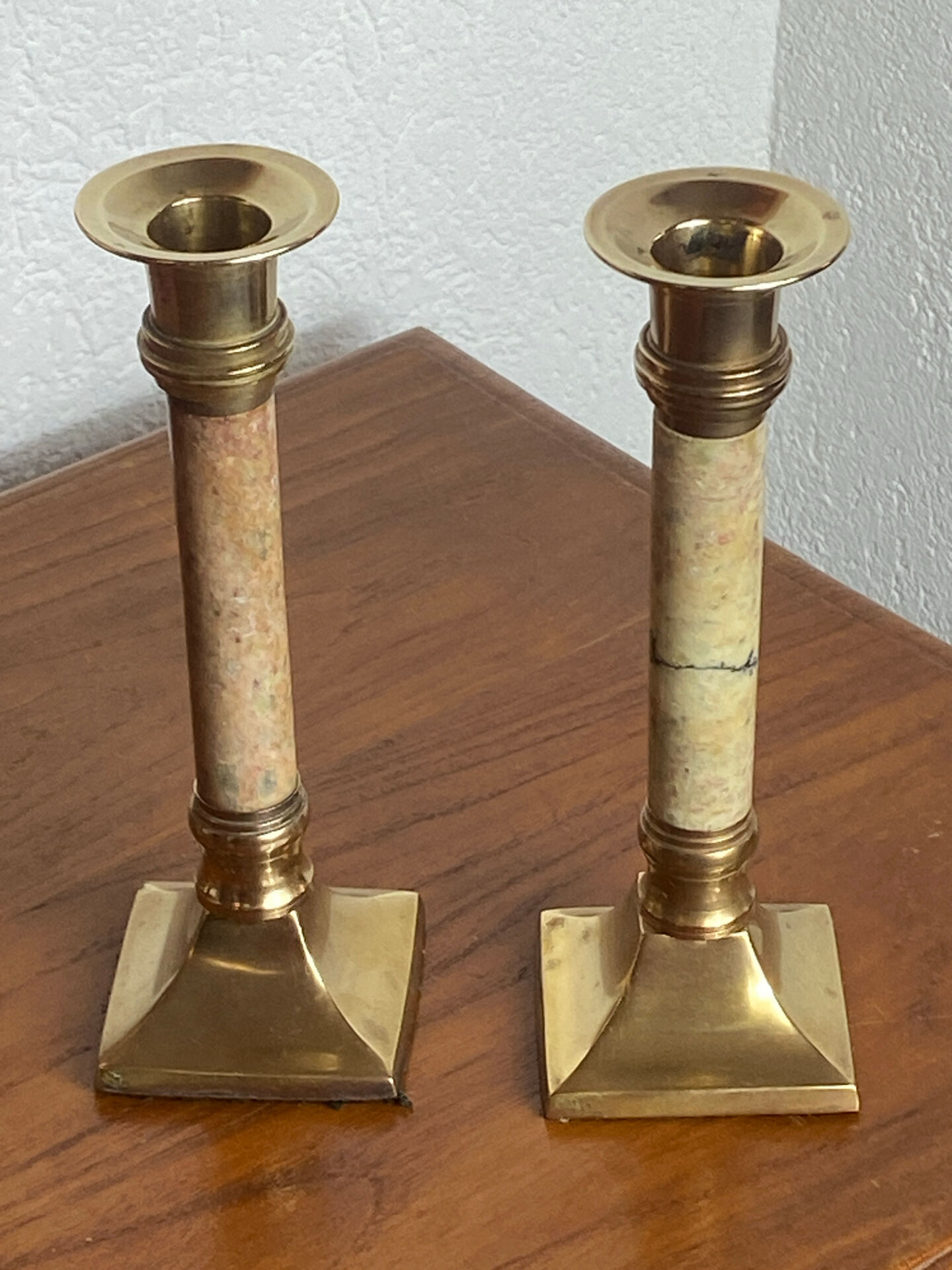 Pair of brass and stone candlesticks