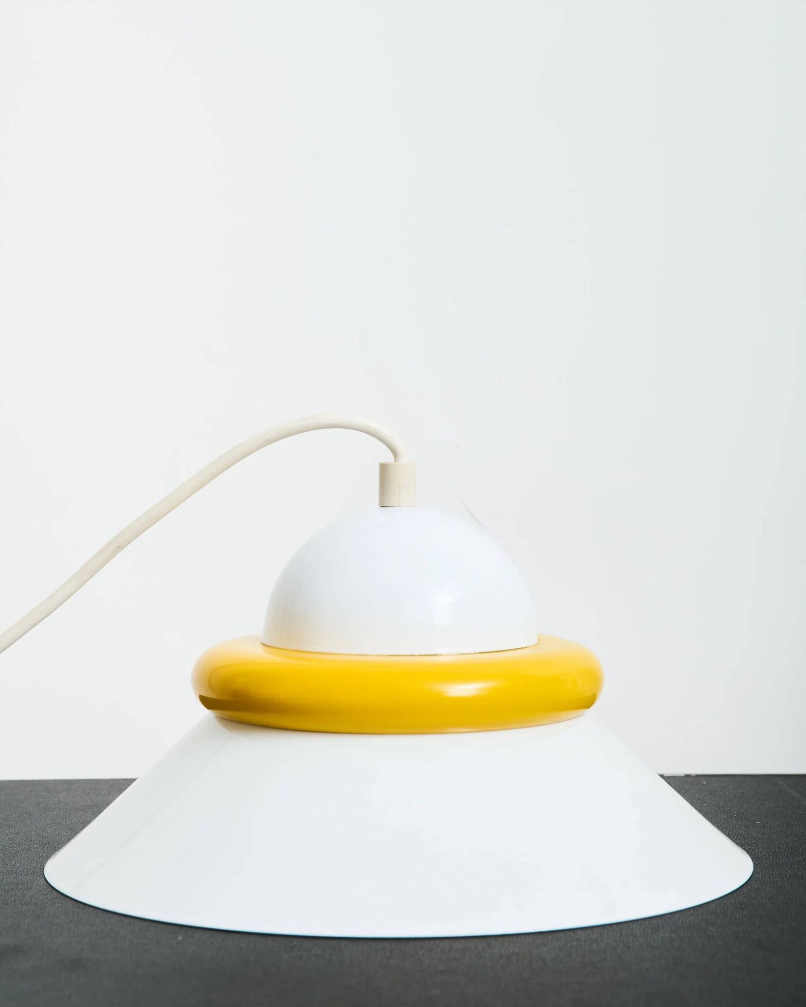 A pair of yellow and white two-tone suspensions, Italy, 1970s.