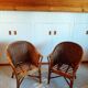 Set of 2 armchairs in adult varnished woven rattan