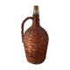 Demijohn surrounded by wicker