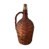 Demijohn surrounded by wicker