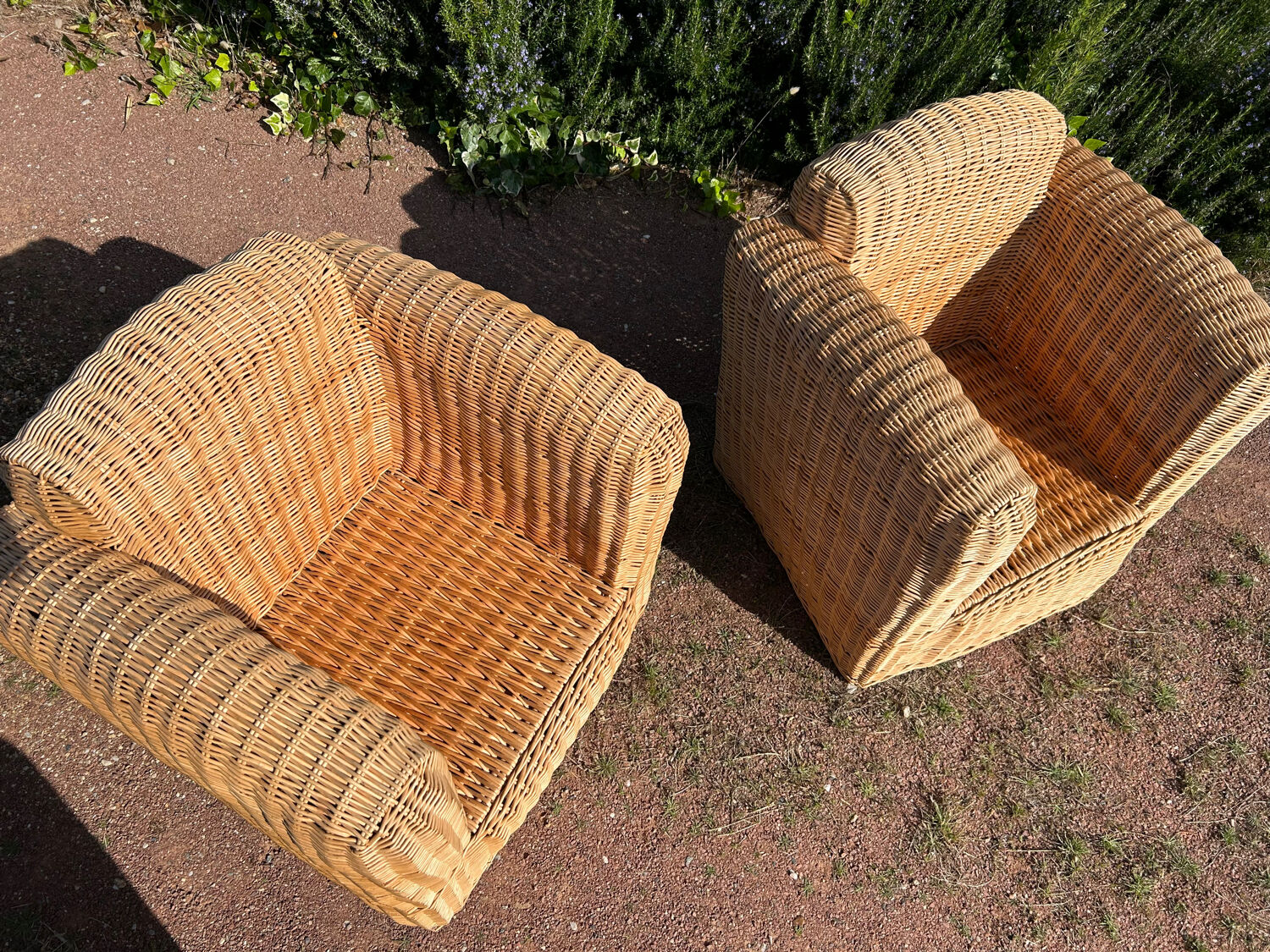 Large rattan armchairs
