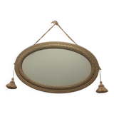 Oval mirror in wood and gilded plaster with pompom decoration