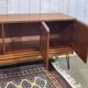 1970s English enfilade in teak with splayed legs.