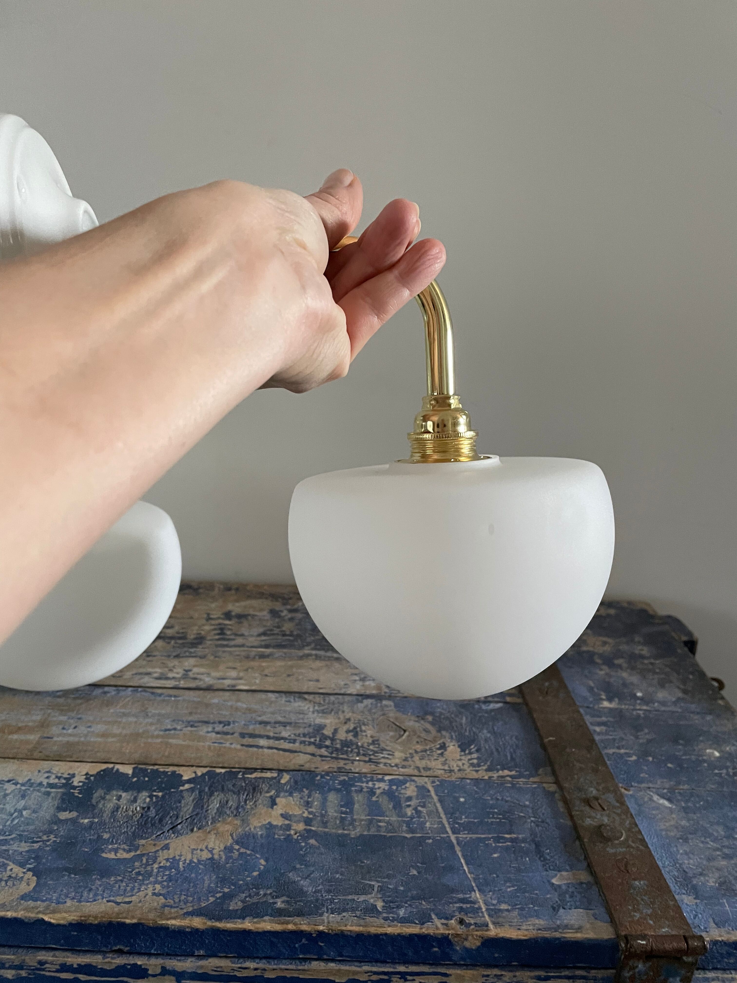 Set of two electrified white opaline wall lamps to nine