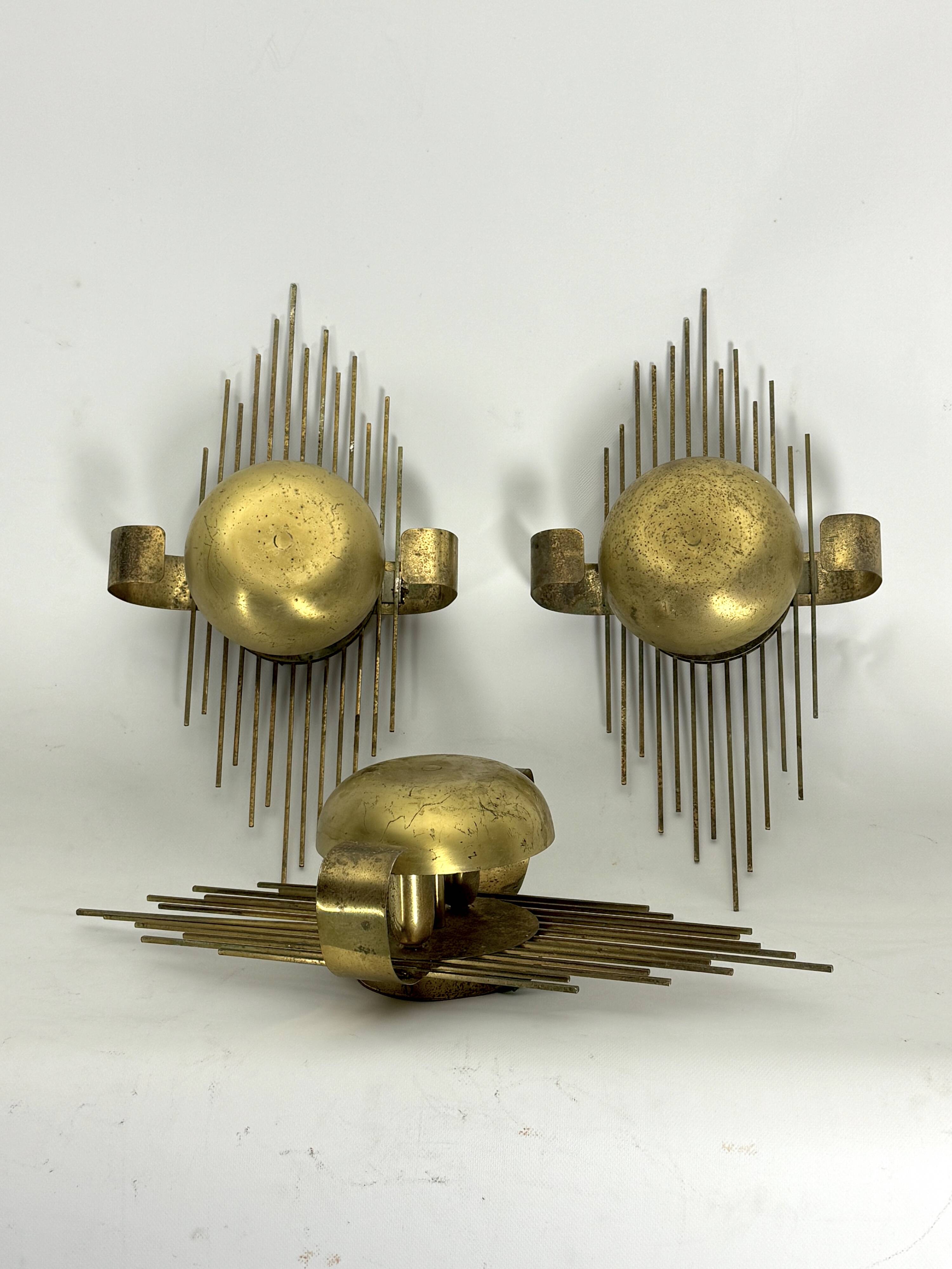 Mid-Century Set of three gilded metal sconces. Italy 1950s