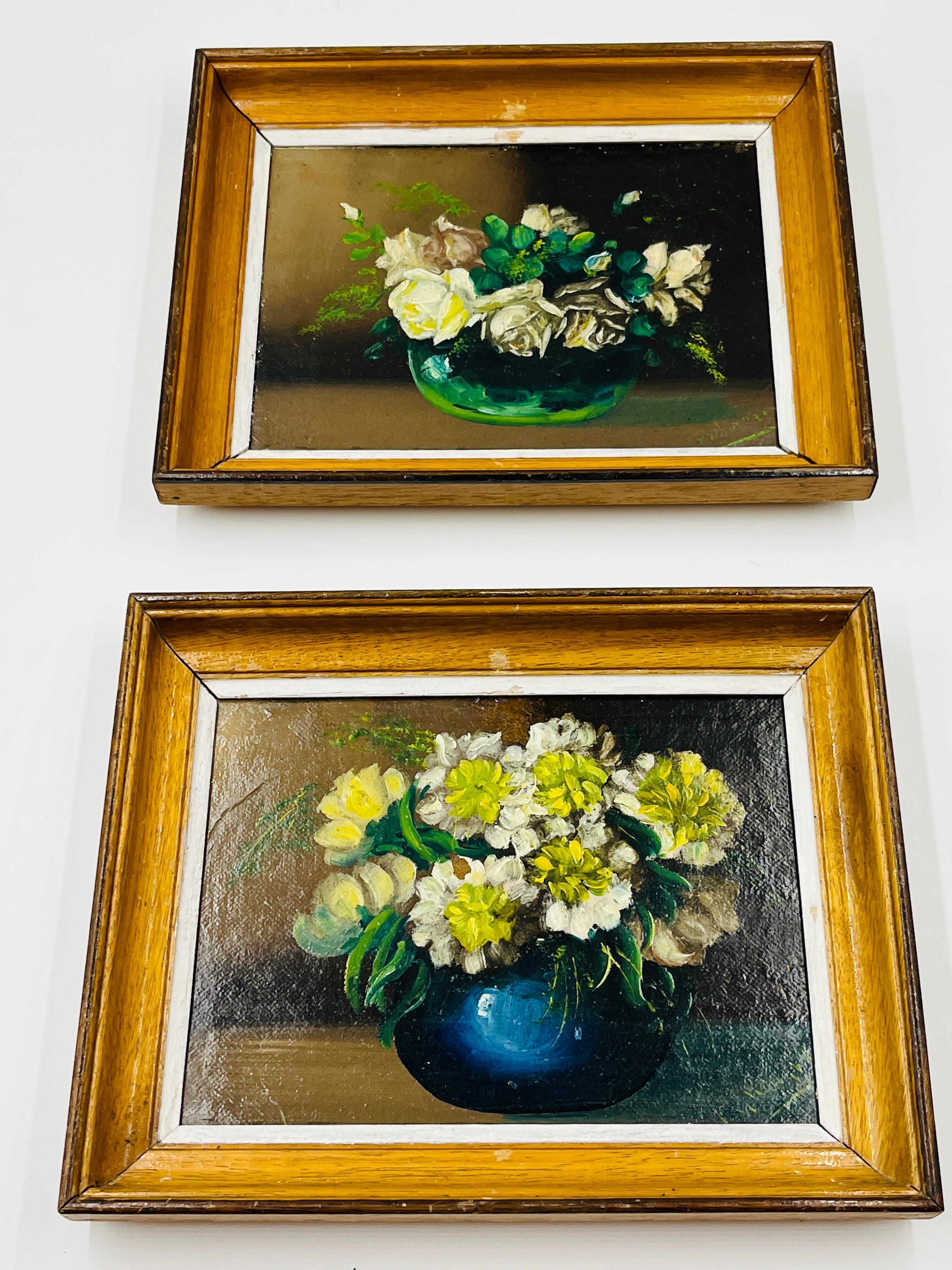 Pair of small framed vintage floral oils