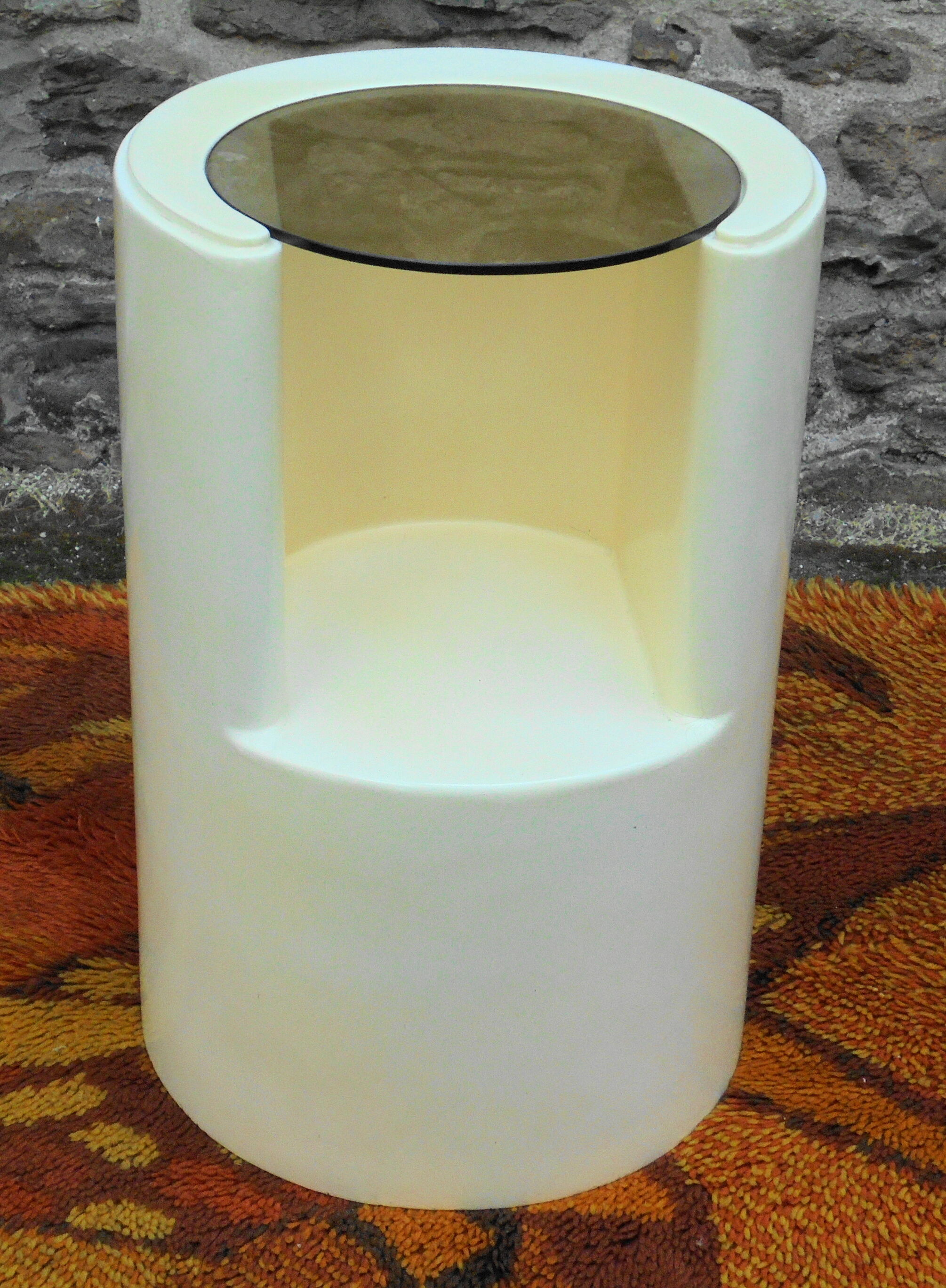Cylindrical fiberglass bedside table from the 60s
