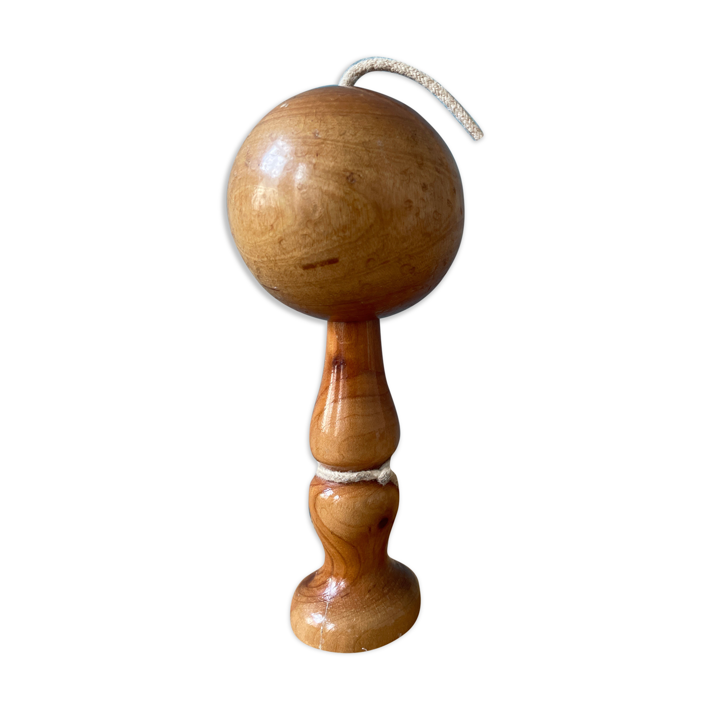 Old bilboquet in varnished wood