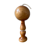 Old bilboquet in varnished wood