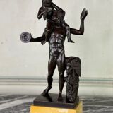 Dionysus on the shoulders of a satyr, bronze after the antique on a yellow Siena base.