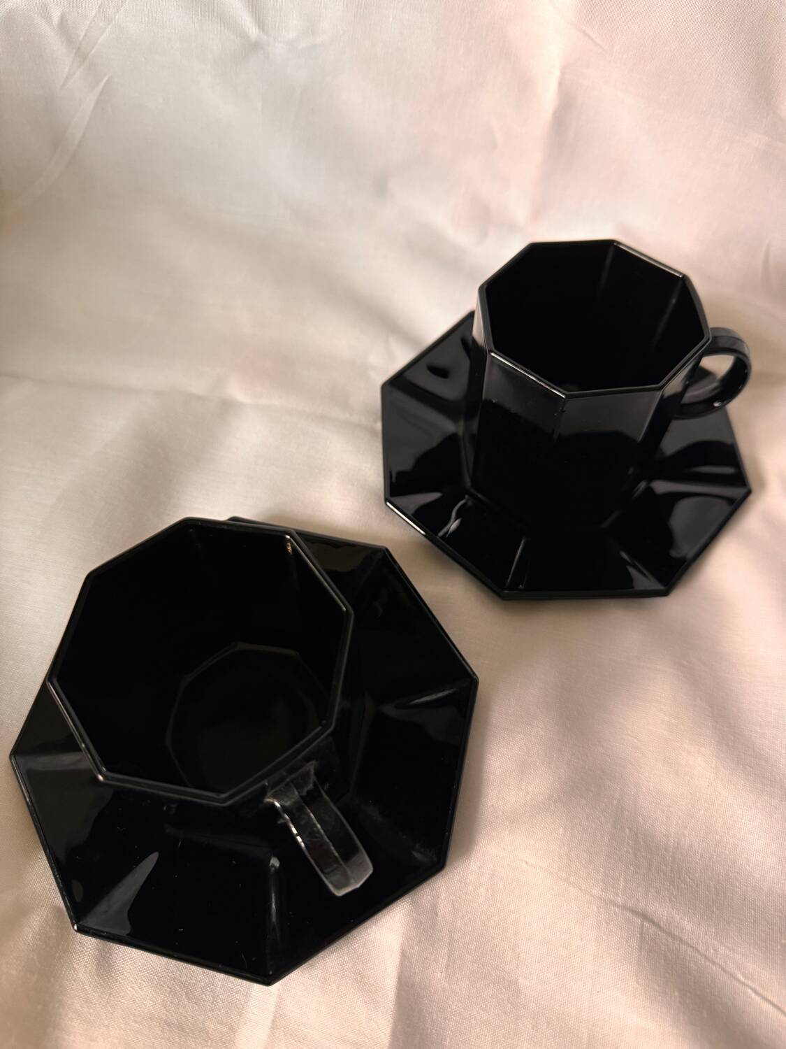 Set of 2 arcoroc black glass coffee cups with underplates